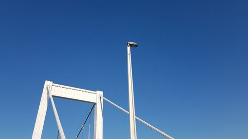 Low angle view of built structure against clear blue sky