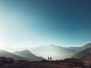 Scenic view of mountains against clear blue sky