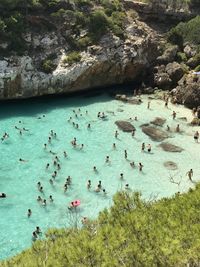 High angle view of people swimming in sea