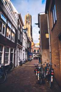 Street amidst buildings in city against sky