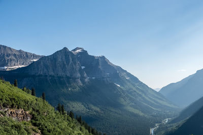 Scenic view of mountains against clear blue sky