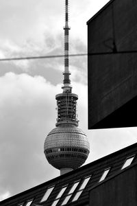 Low angle view of building against cloudy sky