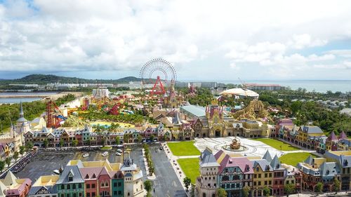 High angle view of ferris wheel in city