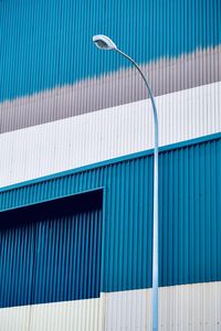 Low angle view of street light against building