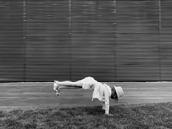 Girl doing stunt on field