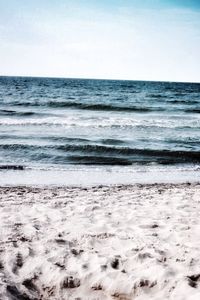 Scenic view of beach against clear sky