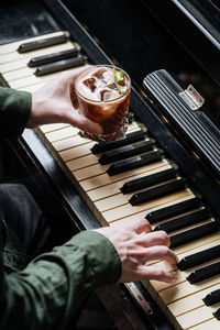 High angle view of man playing piano