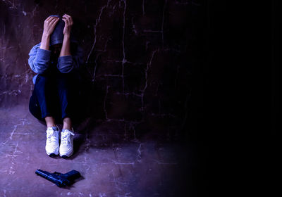 Low section of woman standing on wall