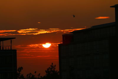 Silhouette of city at sunset