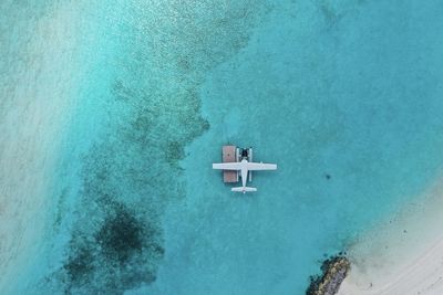 High angle view of sea against blue sky