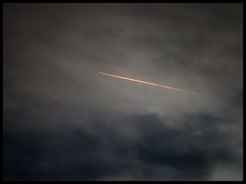 Low angle view of vapor trails in sky