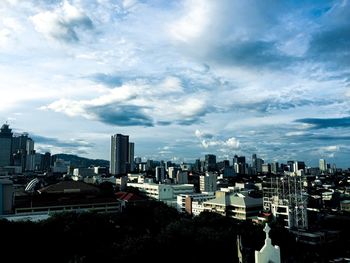 High angle view of buildings in city against sky