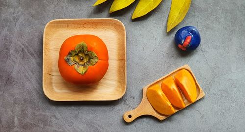 High angle view of fruits on cutting board