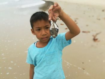 Portrait of cute boy on beach