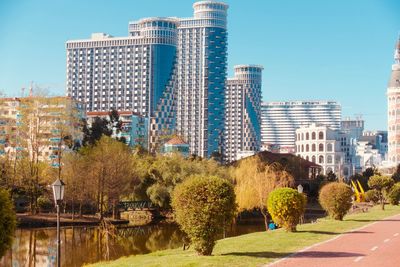 Panoramic view of city buildings against clear sky