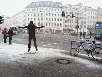 Full length of woman standing in city