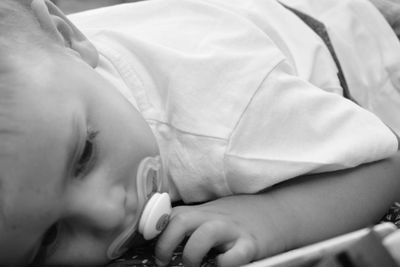 Close-up of baby boy on bed