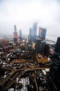 High angle view of buildings in city against sky