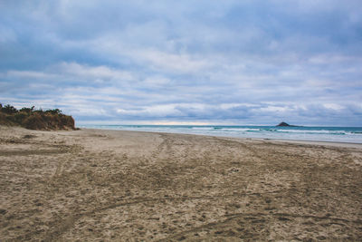 Scenic view of beach against sky