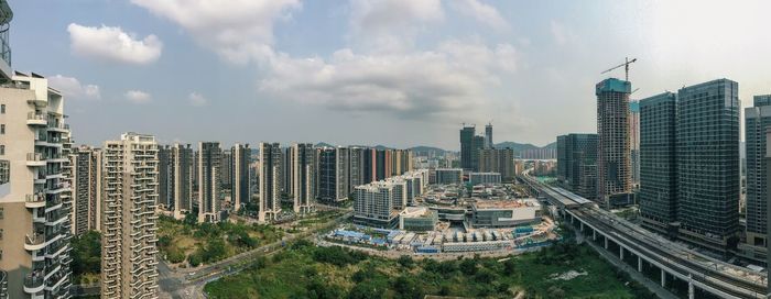 Modern buildings in city against sky