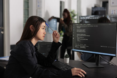 Young businesswoman working at office