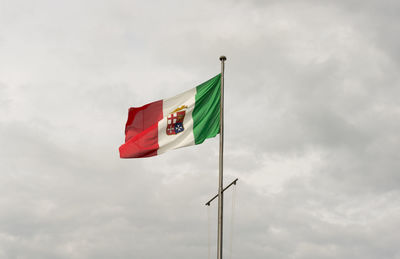 Low angle view of flag against sky