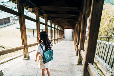 Full length of woman walking on bridge