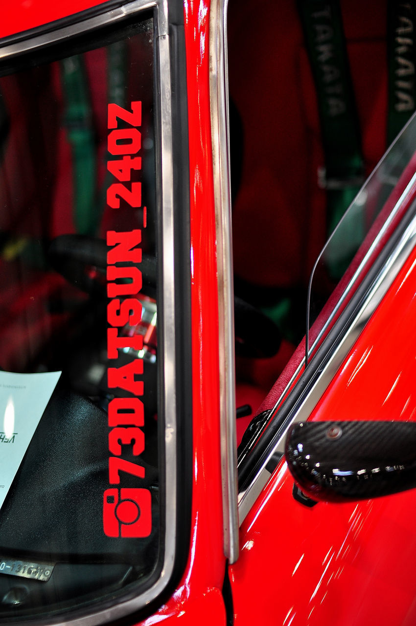 CLOSE-UP OF RED CAR