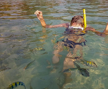 High angle view of man swimming in lake