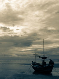 Boat sailing on sea against sky