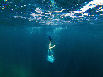 Person swimming in sea