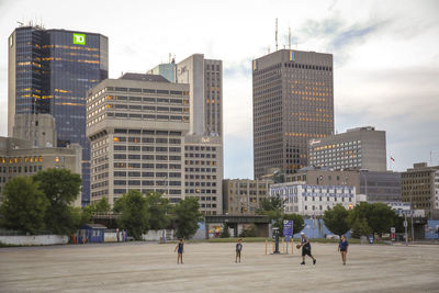 Buildings in city against sky