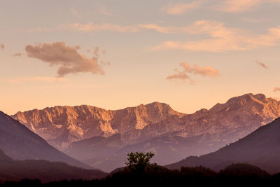 Scenic view of mountains against sky during sunset