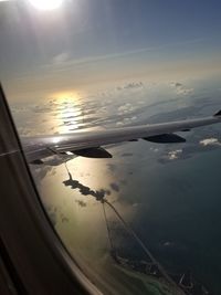 Aerial view of sky seen through airplane window