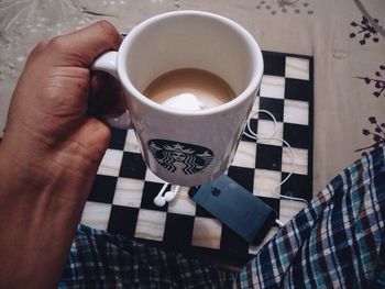 Woman holding coffee cup