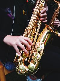 Close-up of hands playing piano