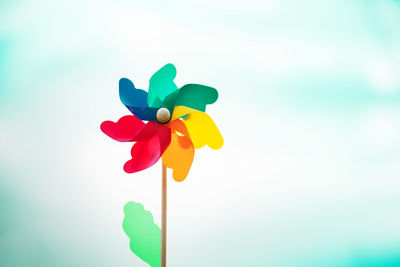 Close-up of multi colored toy against blue sky