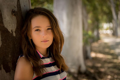 Portrait of teenage girl standing outdoors
