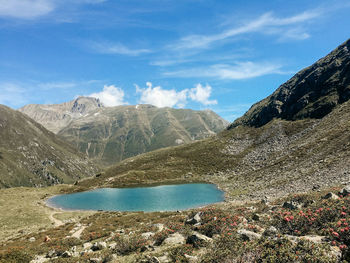 Scenic view of lake and mountains against sky