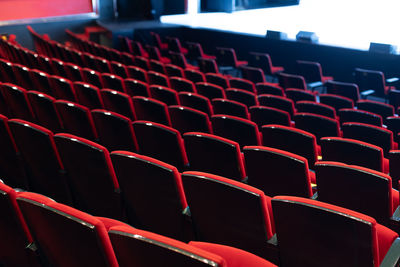 Empty theater seats with white background