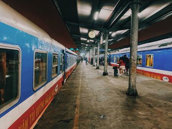 People waiting at railroad station platform