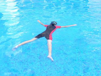 Woman swimming in pool