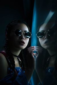 Portrait of young woman wearing sunglasses