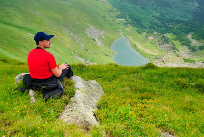 Man sitting on mountain road