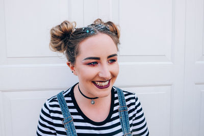 Smiling young woman at home