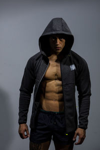 Portrait of muscular man in hood - clothing