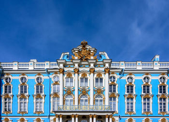 Low angle view of building against blue sky