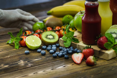 Various fruits on cutting board on table