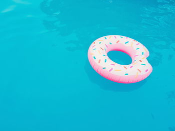 High angle view of inflatable ring floating on swimming pool