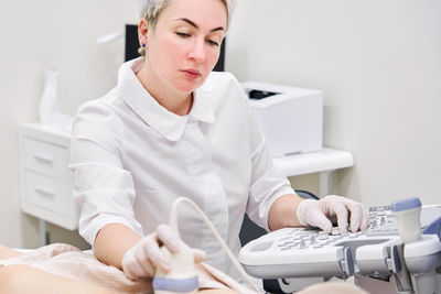 Gynecologist examining patient